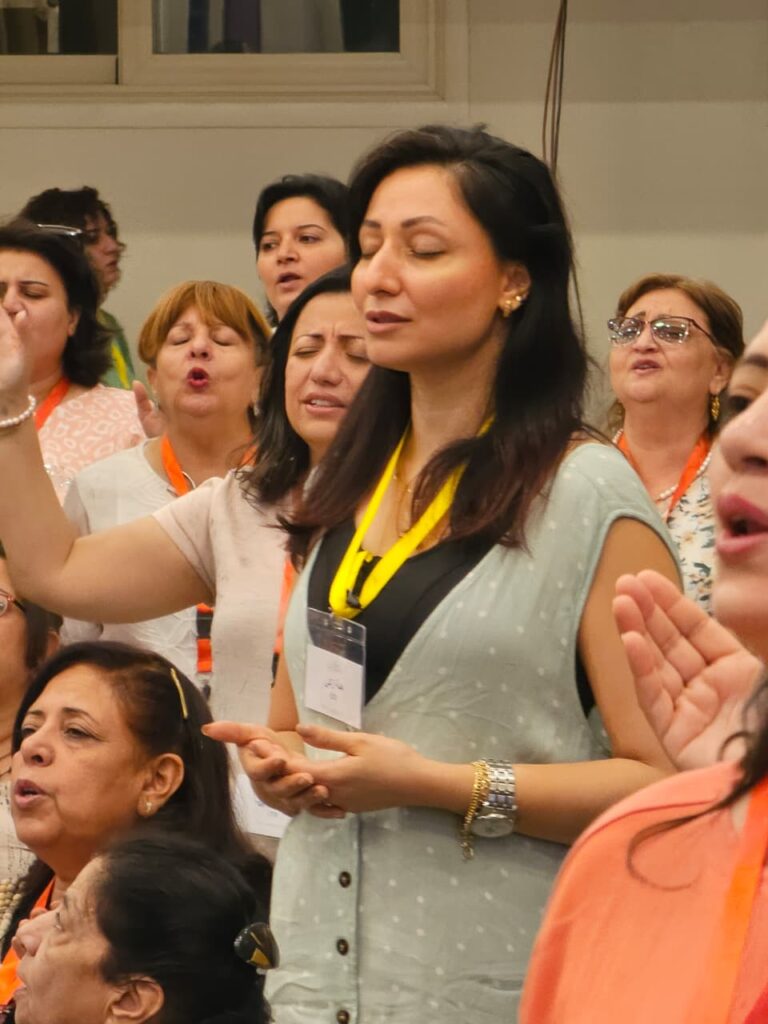 Women worship together openly at the confrence.